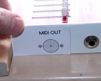 Self-adhesive label for MIDI OUT