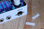 Affix the sticker with MIDI IN to the signal inputs side