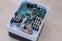 The x9 board with installed cables is in the enclosure.